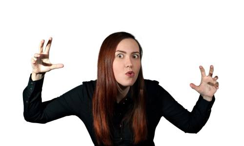 A photo of a girl dressed in black telling scary stories, isolated on a white background